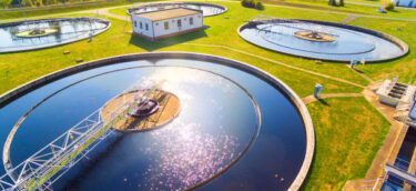 Aerial view to sewage treatment plant. Grey water recycling. Waste management in European Union.